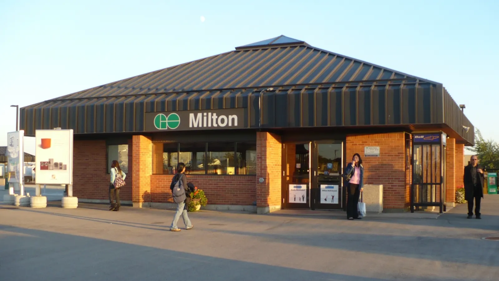 Milton GO Station, with a rising moon and a setting sun